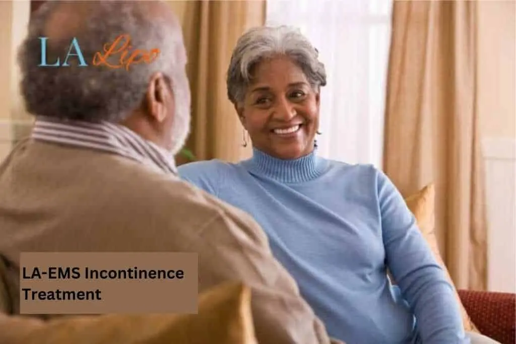 Couple sat smiling at each other - LA-EMS treatment Burgess Hill