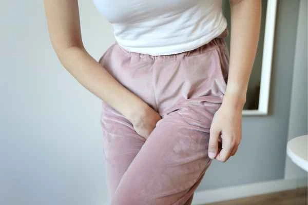 woman running for the toilet because of urinary incontinence Burgess Hill
